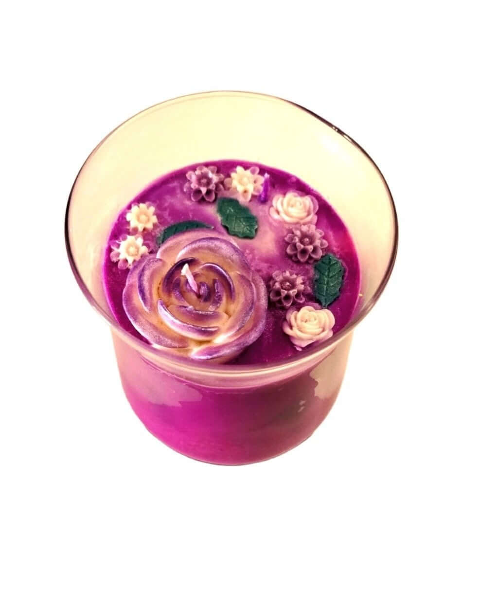 Lavender Valley luxury candle with floral decorations in a glass container, showcasing a serene and calming ambiance.