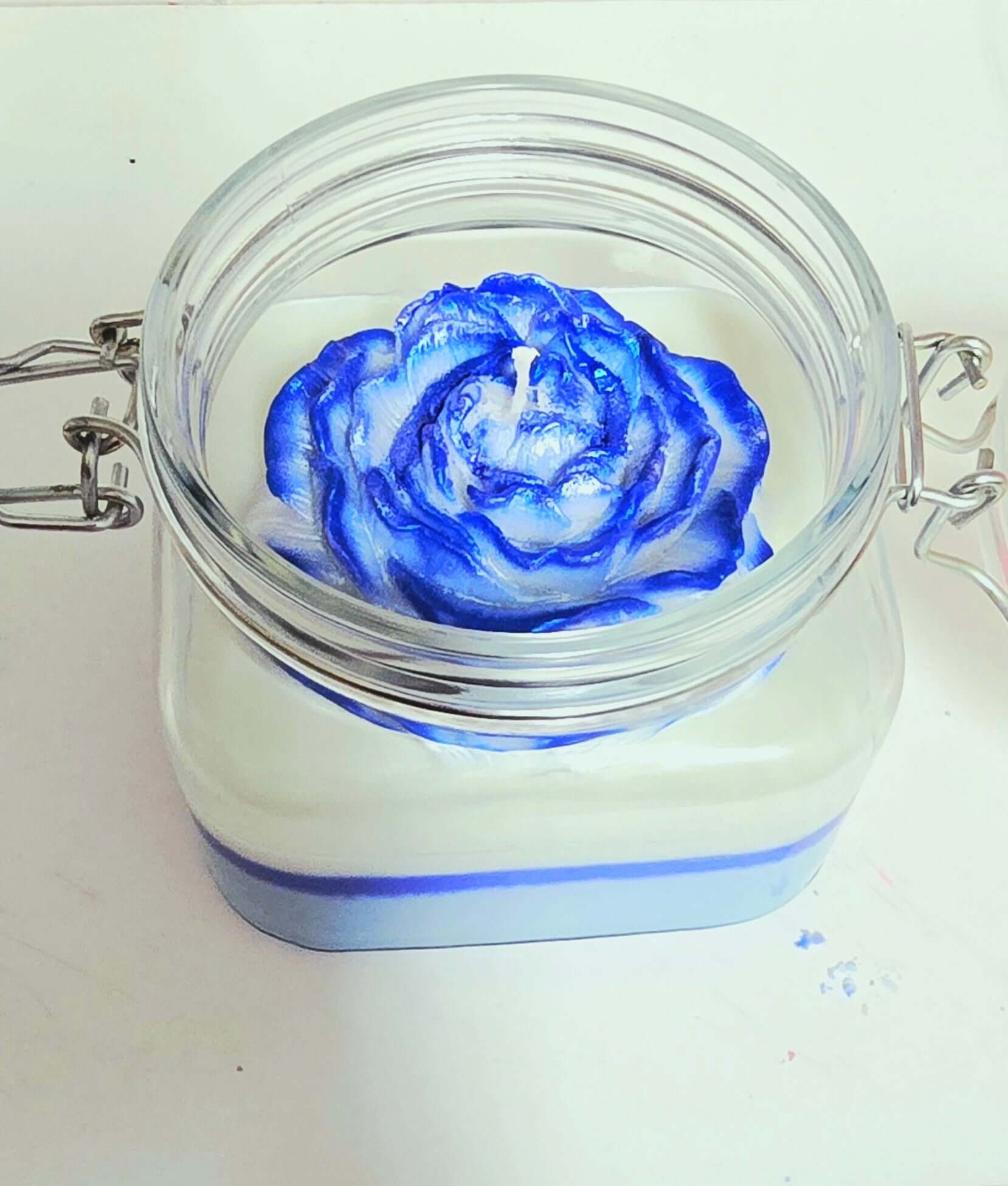 Midnight Blackberry candle top view with blue rose