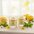 Lemon Verbena candle set styled scene with fresh lemons, verbena sprigs and soft natural light